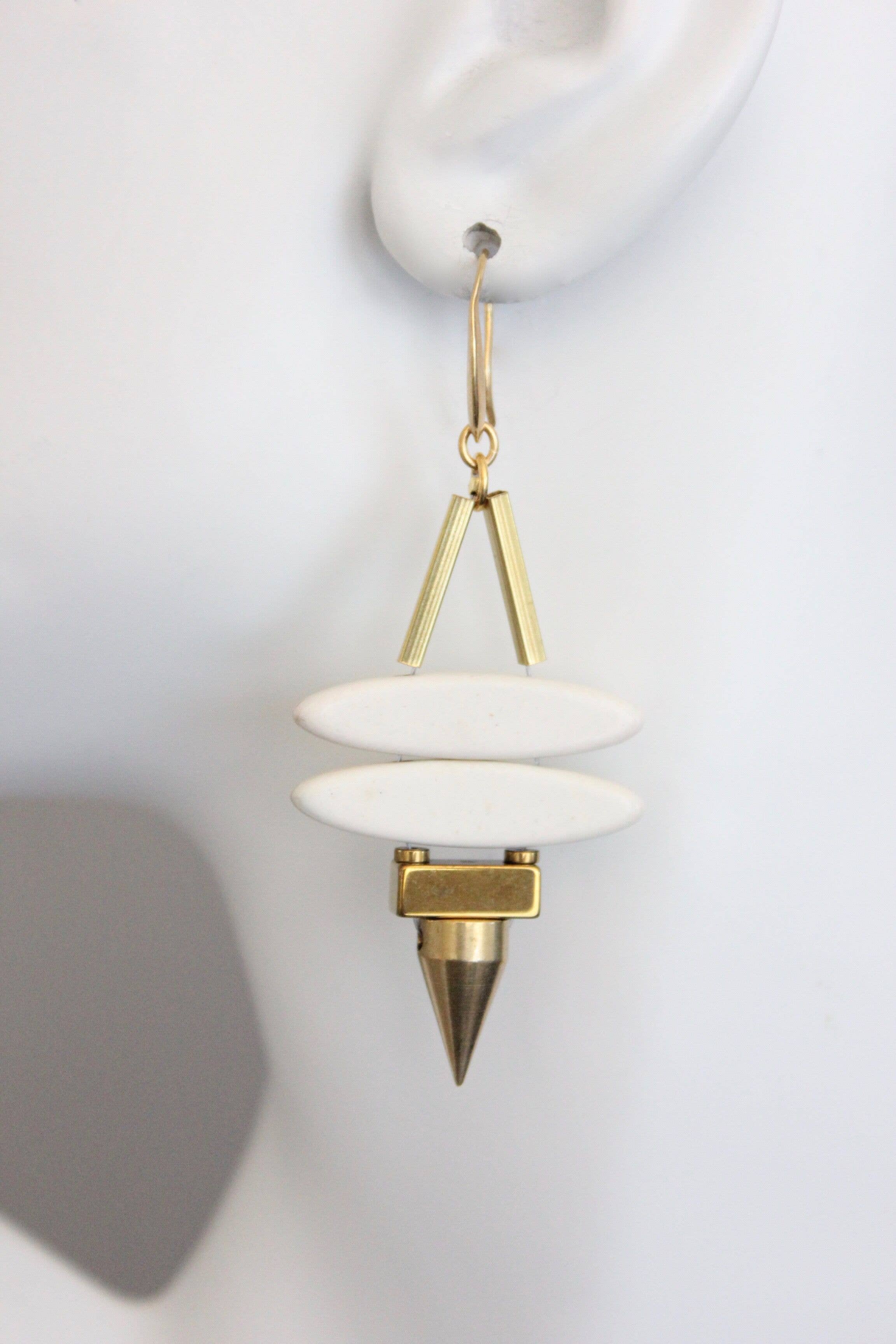 Geometric white stone ellipse & brass spike earrings