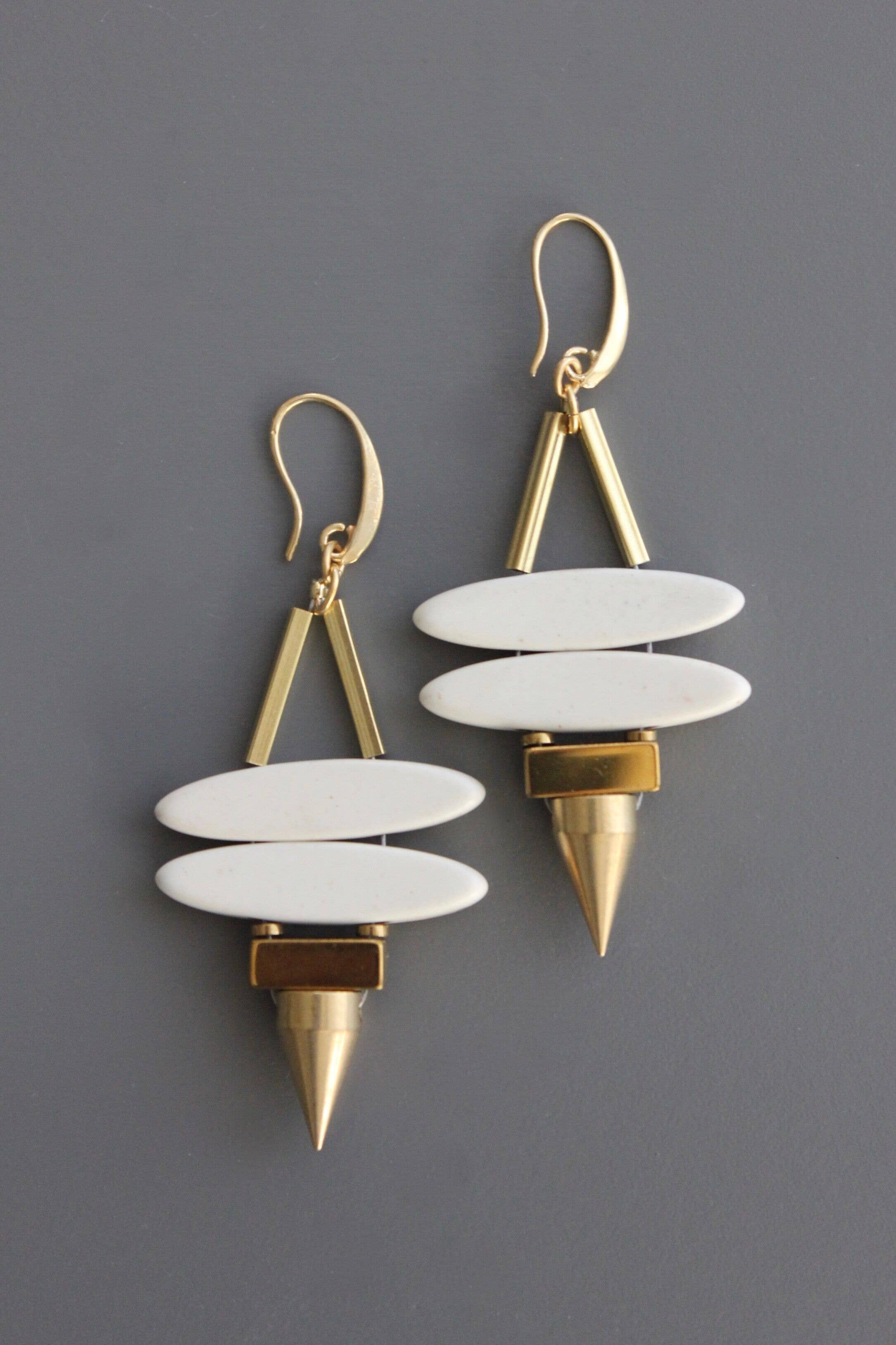 Geometric white stone ellipse & brass spike earrings