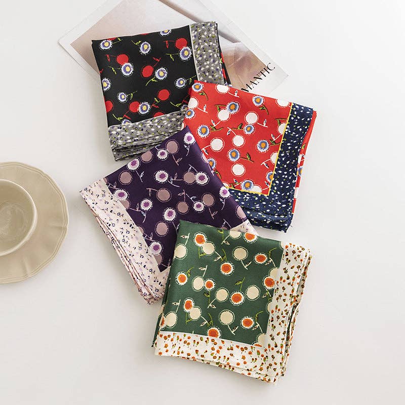 Set of colorful patterned napkins on a white surface with a neutral-colored plate.