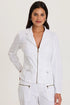 Front view of a woman wearing a structured white cotton fleece zip-up jacket with front pockets and a cozy mock neckline.