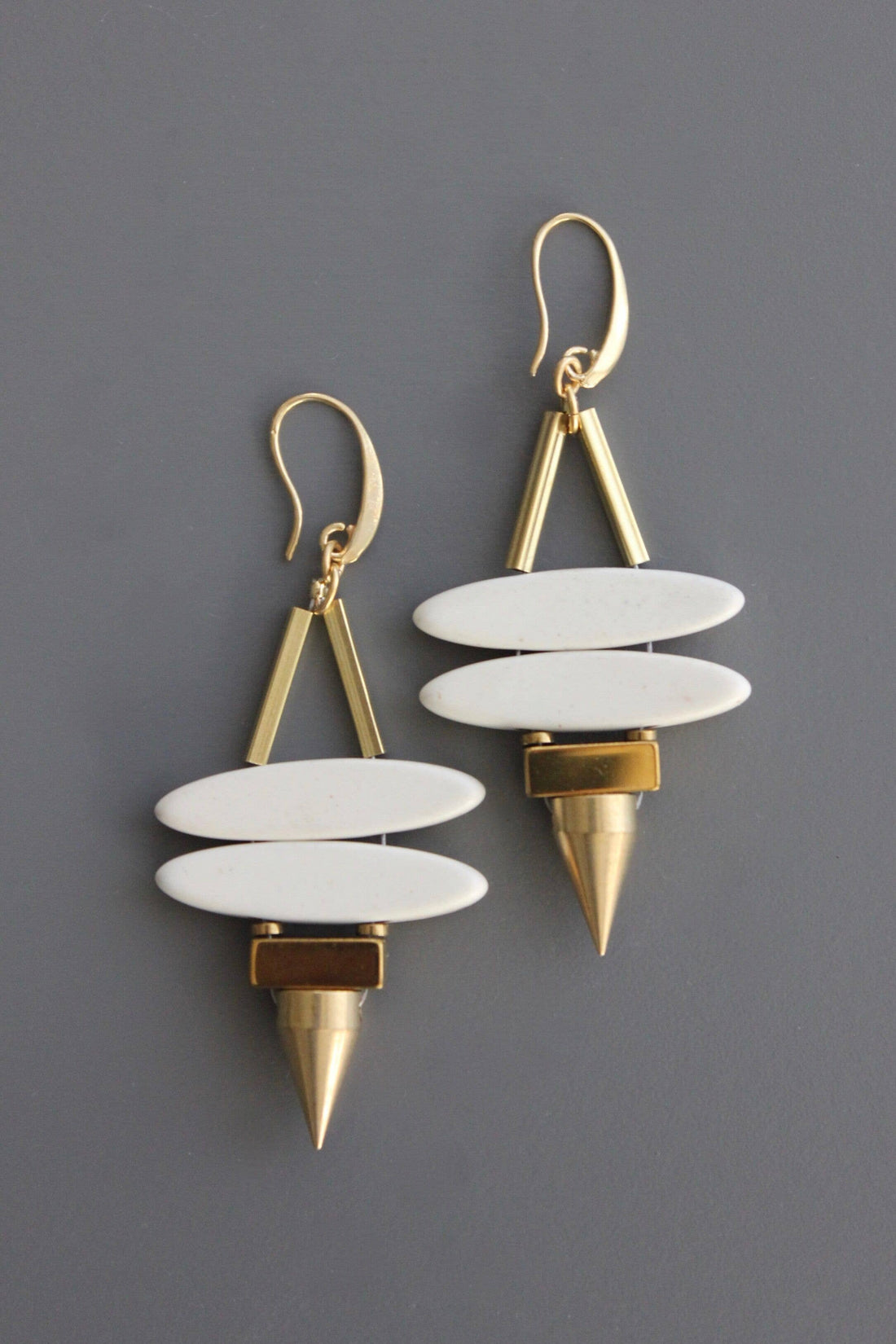 Geometric white stone ellipse &amp; brass spike earrings