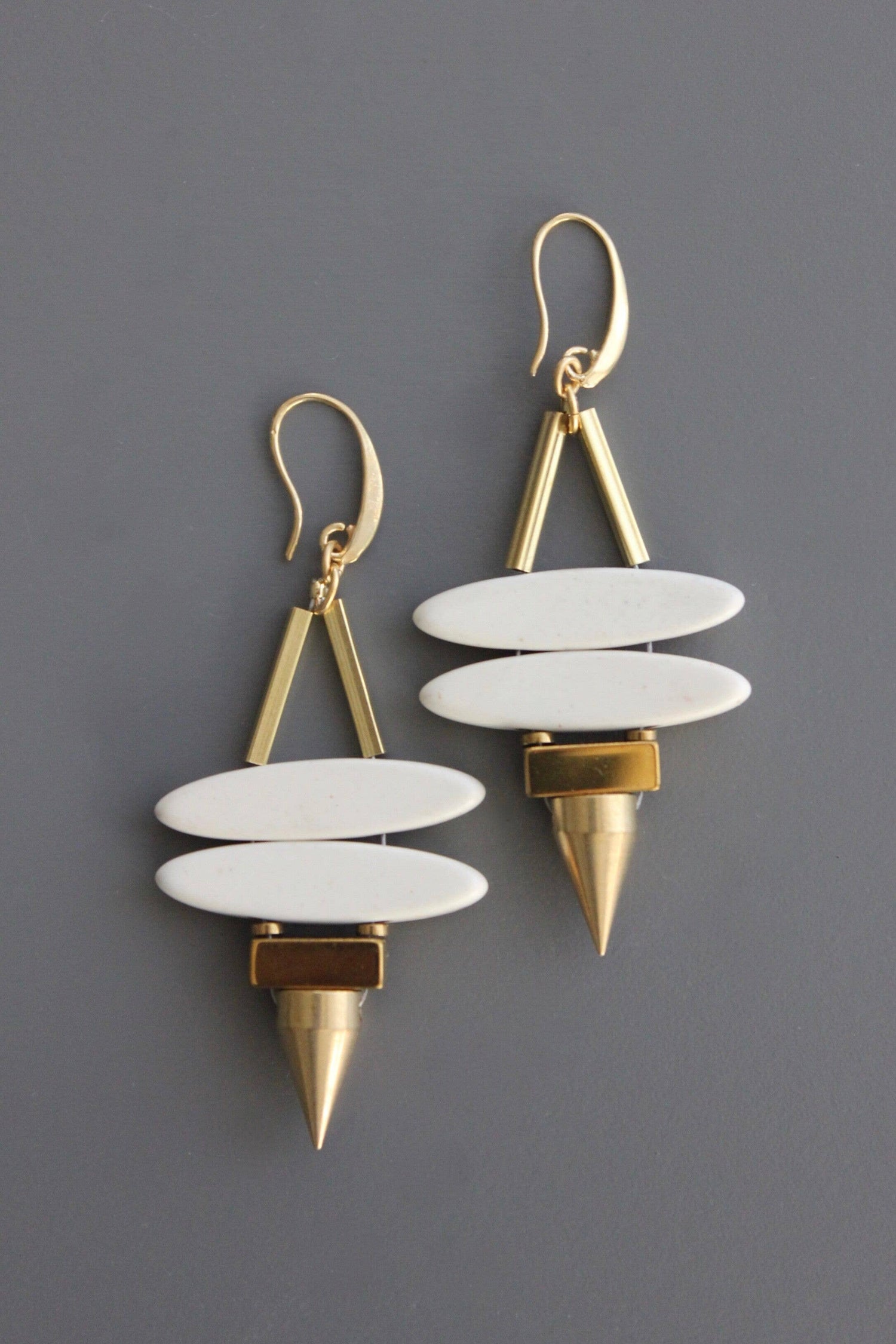 Geometric white stone ellipse &amp; brass spike earrings