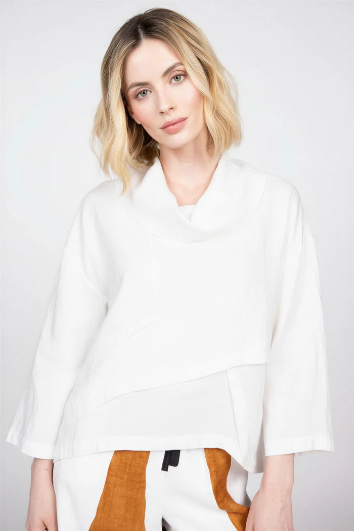 Woman wearing the white elegant seamed cowl top in 100% linen