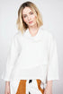 Woman wearing the white elegant seamed cowl top in 100% linen