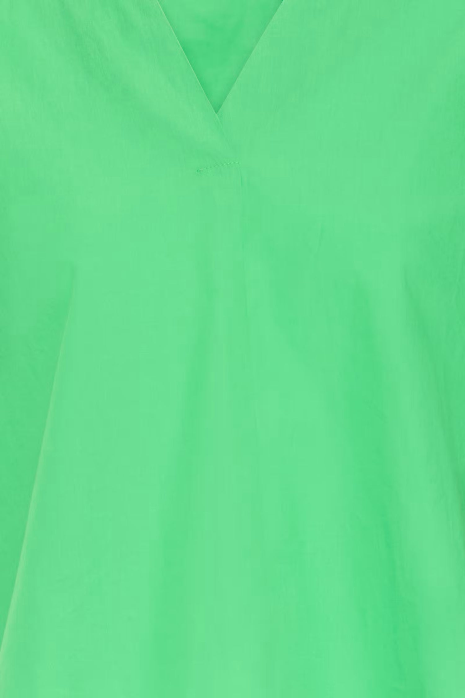 Up close of the green blouse.