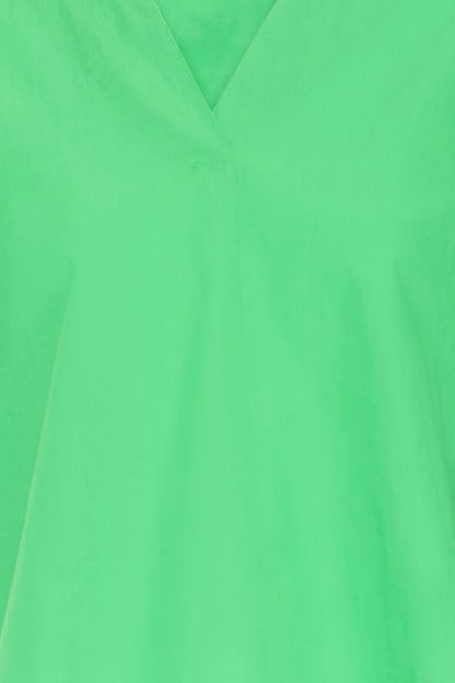Up close of the green blouse.