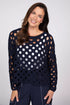 Front view of a woman wearing a navy blue open-knit cotton sweater over a white tank top.