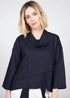Woman wearing a navy blue cowl-necked top against a white background