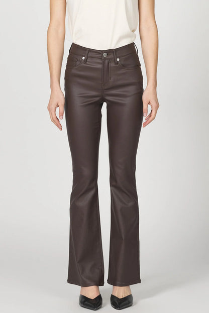 Brown leather pants worn by a person on a white background