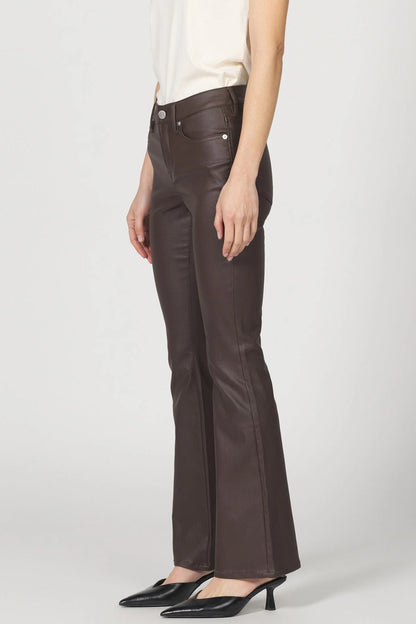 Brown leather pants worn by a person on a white background