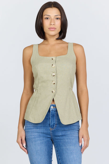 Front view of a woman wearing a sage green linen-blend sleeveless vest with a button front and blue jeans.