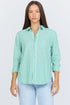 Front view of a woman wearing a green and white vertical striped long-sleeve cotton button-up shirt with light blue jeans.
