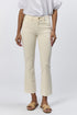Front view of a woman wearing the cream mid-rise raw hem flare jeans with gold hardware and a white top.